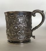 An embossed silver half pint mug attractively deco