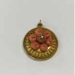 A good Victorian coral target pendant with central