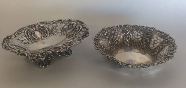 Two silver embossed bonbon dishes heavily decorate