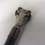 An unusual bone walking stick mount in the form of