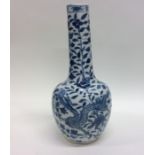A tall Chinese blue and white baluster shaped vase
