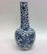 A tall Chinese blue and white baluster shaped vase