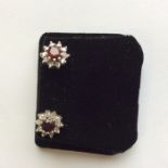 A pair of gold mounted ruby and diamond cluster ea