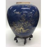 A large blue ground Chinese vase decorated with ho
