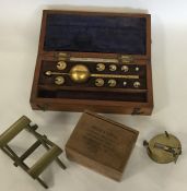 A selection of unusual brass curios to include an apothecary's paper