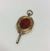 A Georgian gold watch key inset with cornelian and