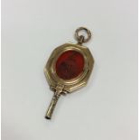 A Georgian gold watch key inset with cornelian and