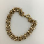 A heavy 9 carat curb link bracelet with ring clasp