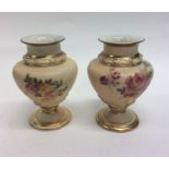 An attractive pair of Royal Worcester vases decora
