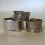 A group of three silver napkin rings. Various date