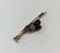 A good quality cabochon garnet and rose diamond br