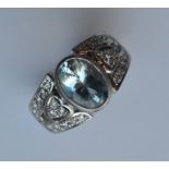 A heavy aquamarine and diamond ring in platinum ru