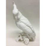 A white ground figure of a parrot with textured bo