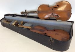 Two old violins. Est. £15 - £20.