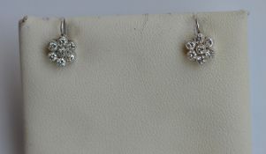 A pair of small circular cluster earrings with loo