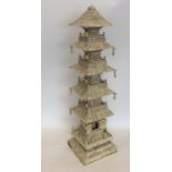 A tall unusual pagoda of tapering form attractivel