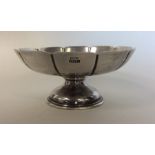 A silver half fluted sweet dish on pedestal base.