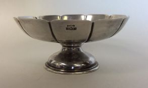 A silver half fluted sweet dish on pedestal base.