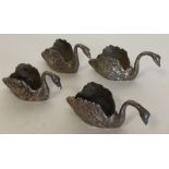 A heavy set of four cast silver swans with texture