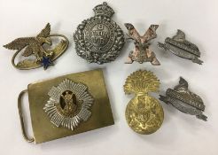 A selection of Military badges, to include two x Lincolnshire
