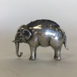 A miniature silver pin cushion in the form of an e