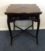 An Edwardian mahogany envelope card table with str