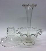 A small glass epergne with wavy edge together with