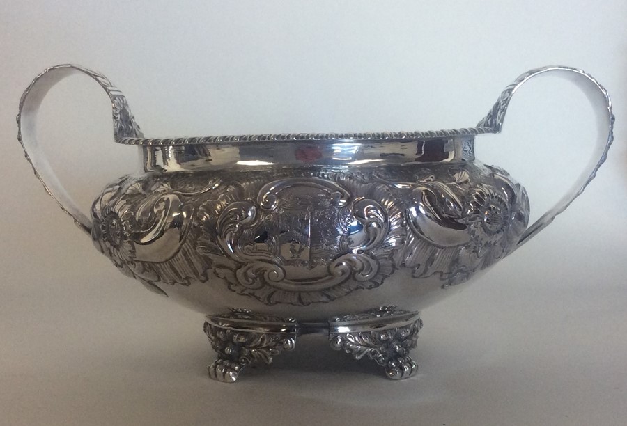 A Georgian embossed silver sugar bowl, the body de