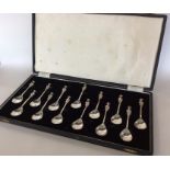 A good set of thirteen silver cast seal top apostl