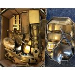 A box containing various brass and other metal mod