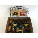 A box containing various unboxed models of Yestery