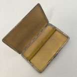 A heavy silver engine turned cigarette case with g