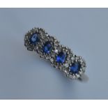 An attractive 18 carat sapphire four cluster ring.