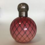 An attractive cranberry glass scent bottle with sc