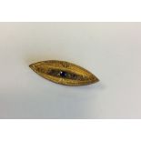 A sapphire and diamond boat shaped brooch with loc