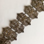 BERLIN STEEL: A six panel pierced bracelet decorat