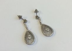 A pair of French pear shaped diamond drop earrings