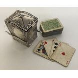 A novelty silver playing card holder in the form o