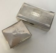 A heavy silver cigarette box with bright cut decor