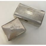 A heavy silver cigarette box with bright cut decor