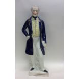 A large Staffordshire figure of a gent with gilded