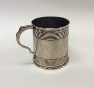 A small Victorian silver christening cup of taper