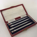 A cased set of four Sterling silver bridge pens. A