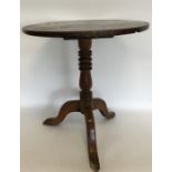 An Antique fruit wood tripod table with hinged top