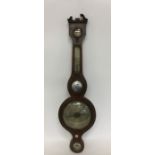 A mahogany and brass inlaid banjo barometer. By P