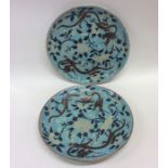 A pair of Chinese floral plates attractively decor