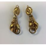 A pair of large diamond drop earrings decorated wi