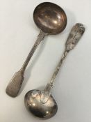 A silver fiddle pattern sauce ladle. London. By GA