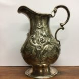 An attractive Victorian silver cream jug decorated