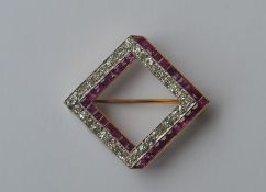 A good Art Deco ruby and diamond brooch of square